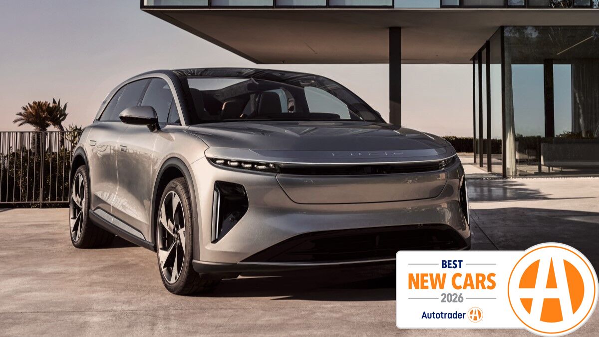 Lucid Gravity parked in front of a building.