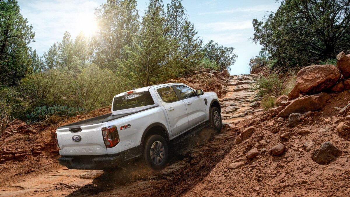 2026 Ford Ranger climbing a rocky dirt trail.