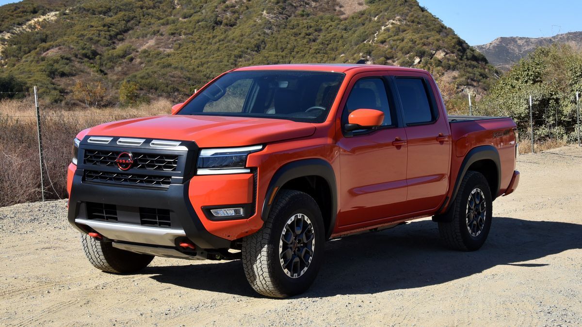 2025 Nissan Frontier Pro-4X parked on dirt with hills in the background.