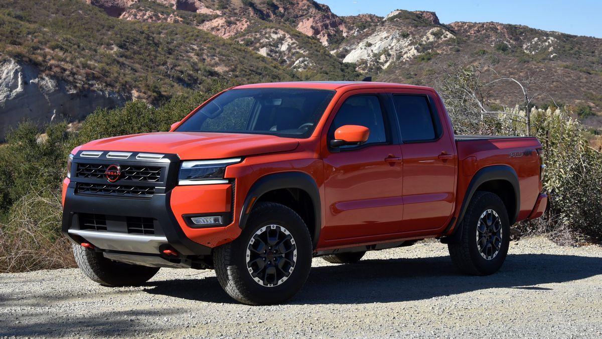 2025 Nissan Frontier Pro-4X parked on dirt with hills in the background.
