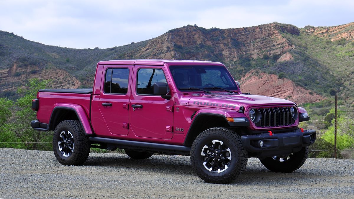 2025 Jeep Gladiator Rubicon parked on a dirt road with red hills in the backgound.