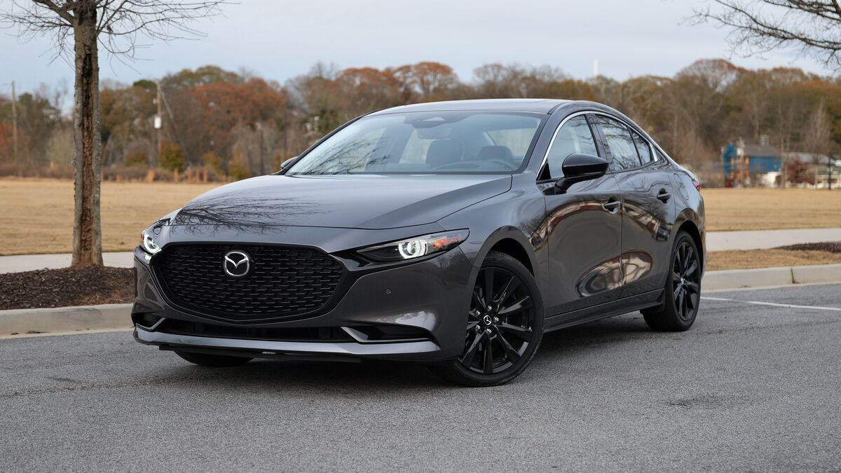 2026 Mazda3 Sedan parked in a park.