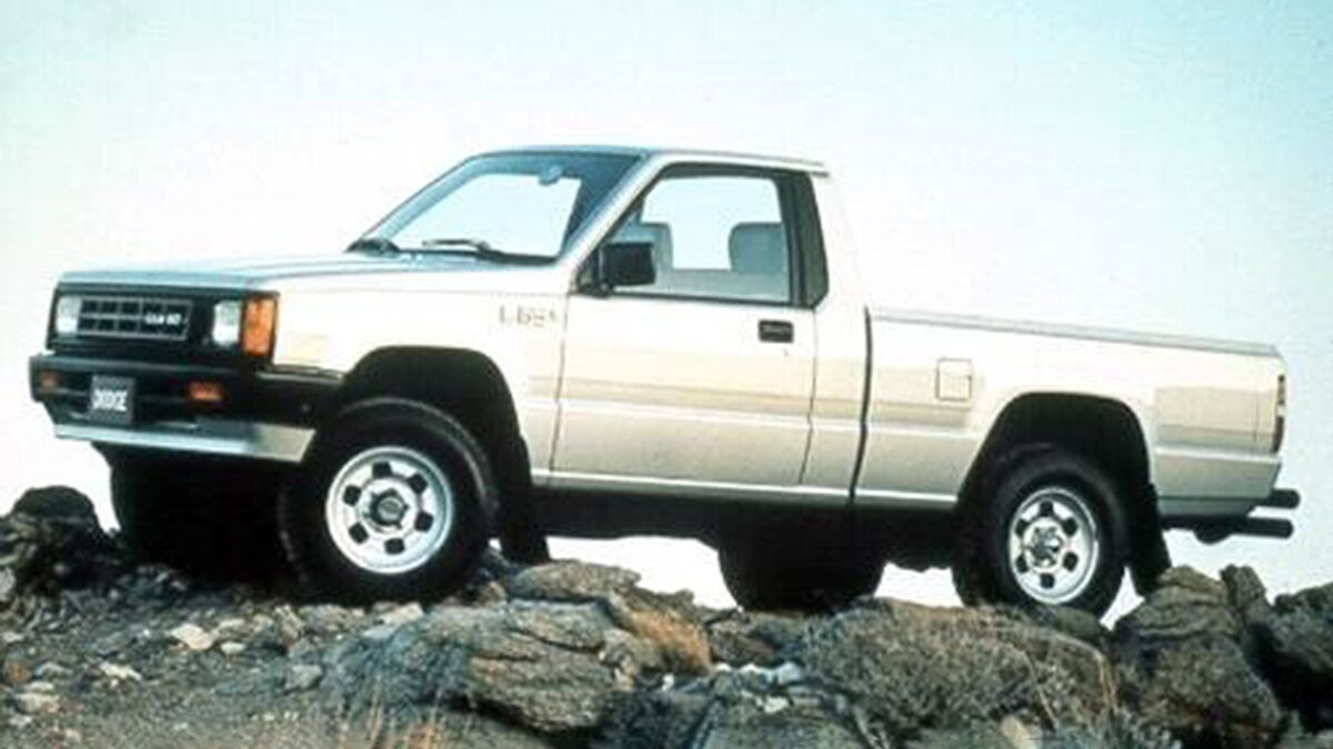 1993 Dodge Ram (pre-'1500') parked on top of a rock.