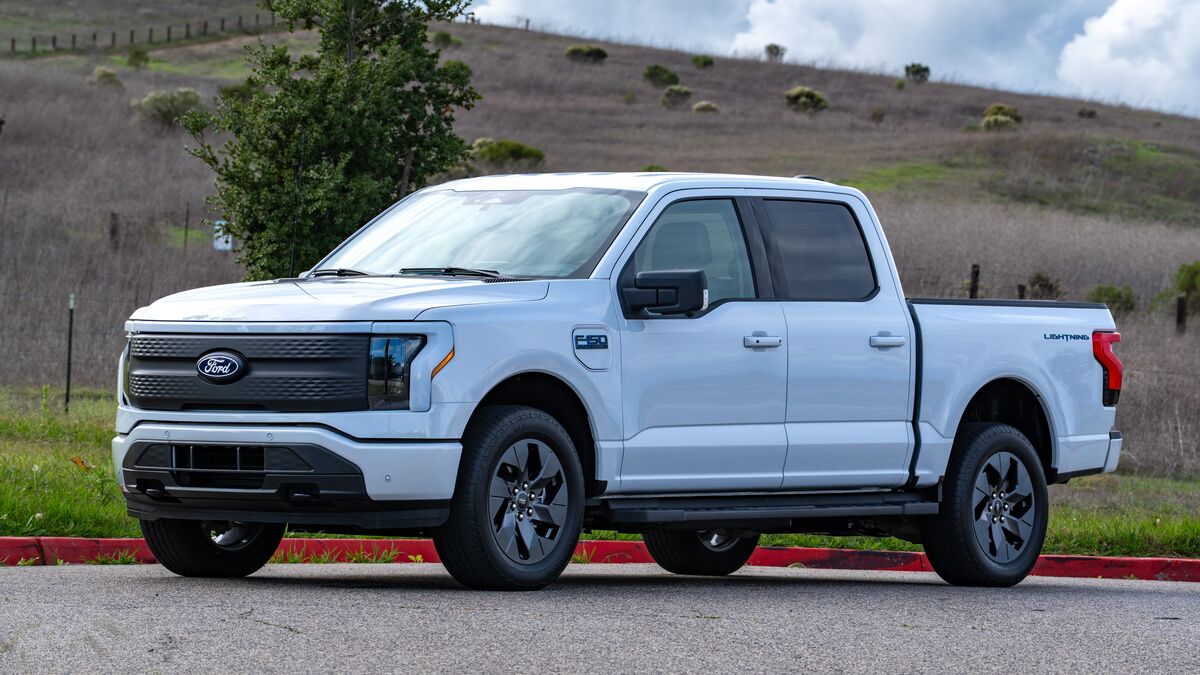 Front 3/4 view of the 2025 Ford F150 Lightning Flash on a sunny day