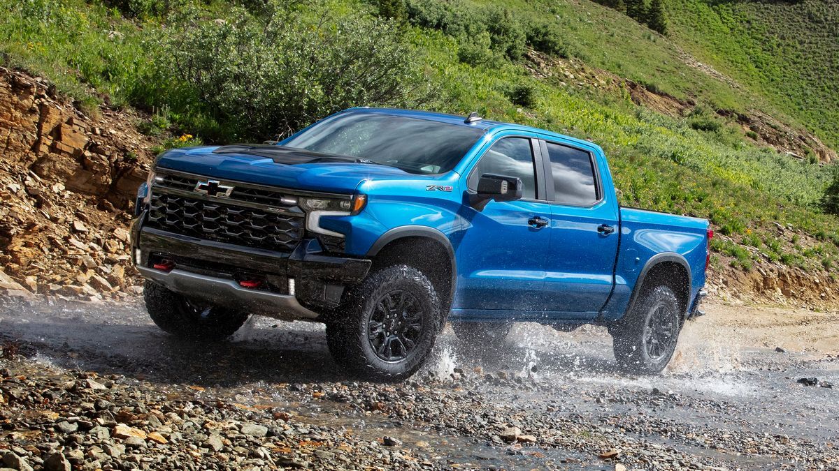 2025 Silverado ZR2 driving near a hillside.