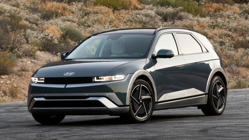 2025 Hyundai IONIQ 5 on a mountain road at sunrise.
