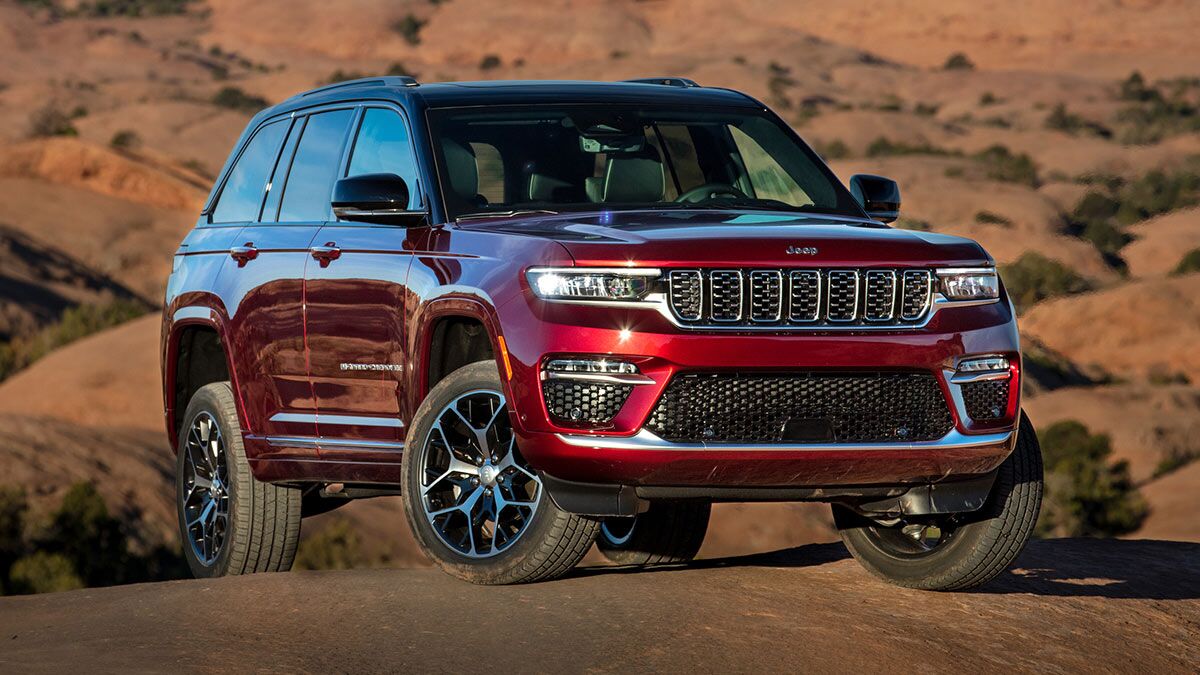 2025 Jeep Grand Cherokee Summti Reserve parked with hills in the background.