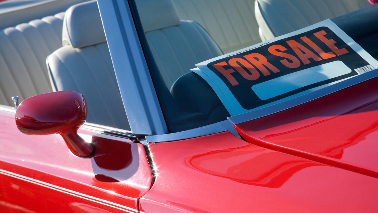 For Sale sign in a vintage car