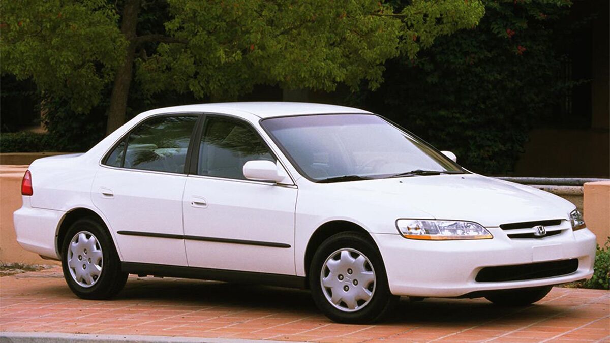 1998 Honda Accord parked outside.