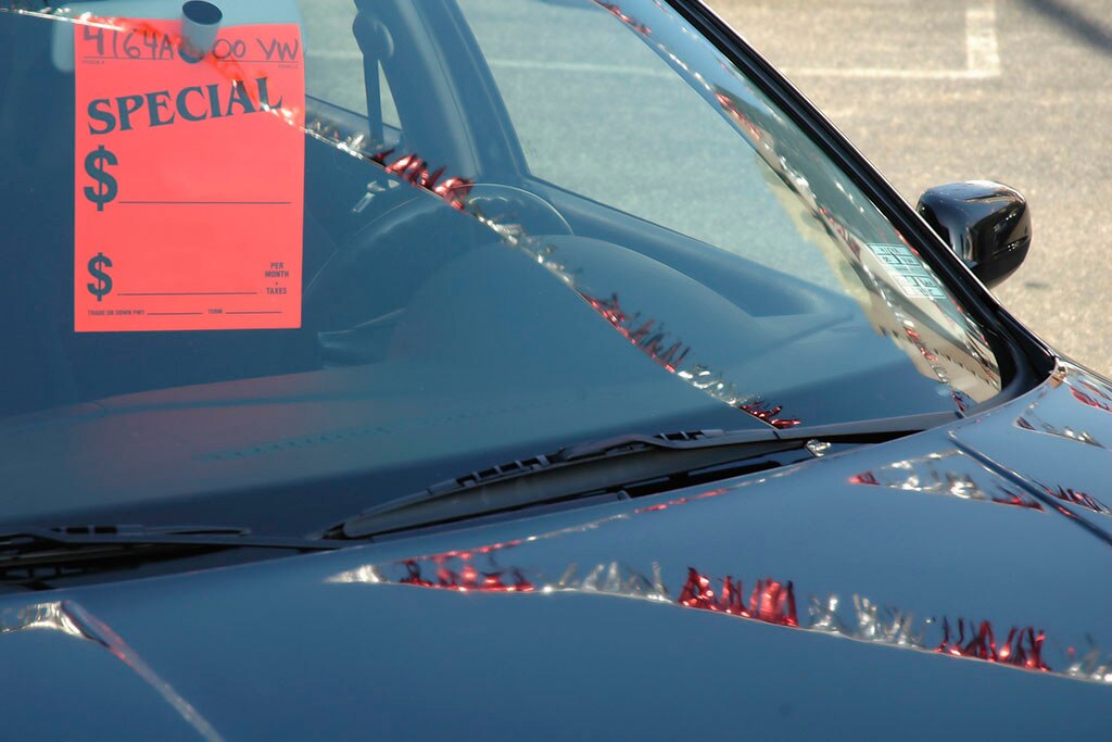 better to buy new or used car