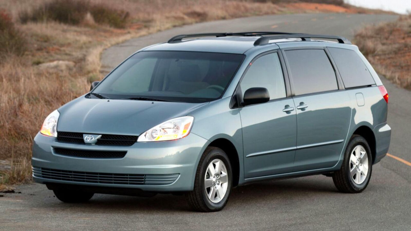 2006 Toyota Sienna Lado izquierdo delantero en azul claro