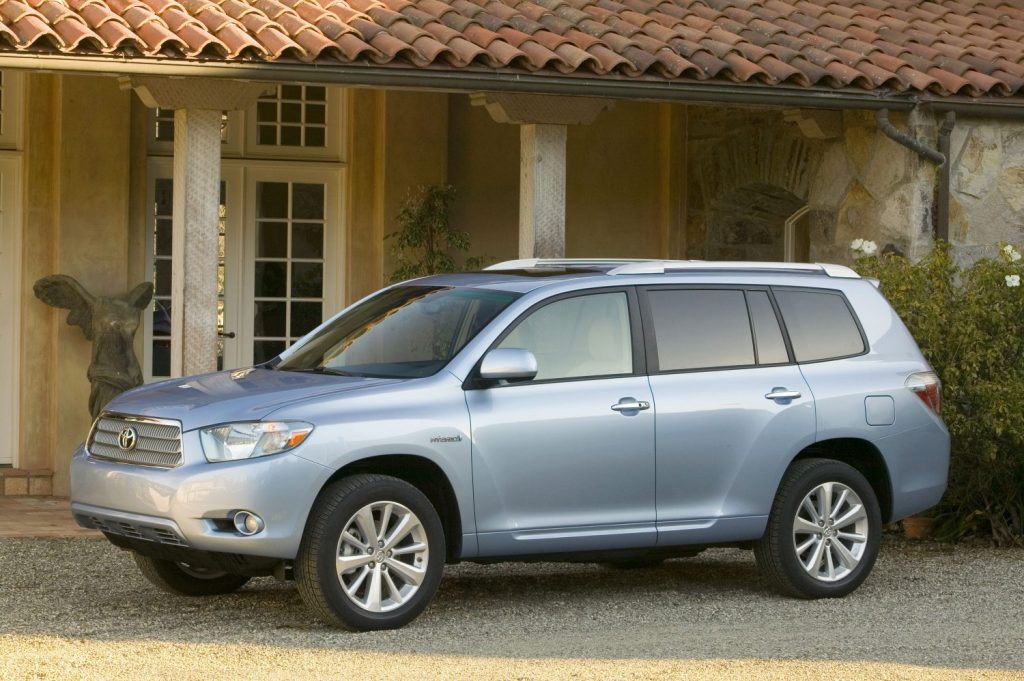 2010 Toyota Highlander Hybrid perfil izquierdo en azul claro