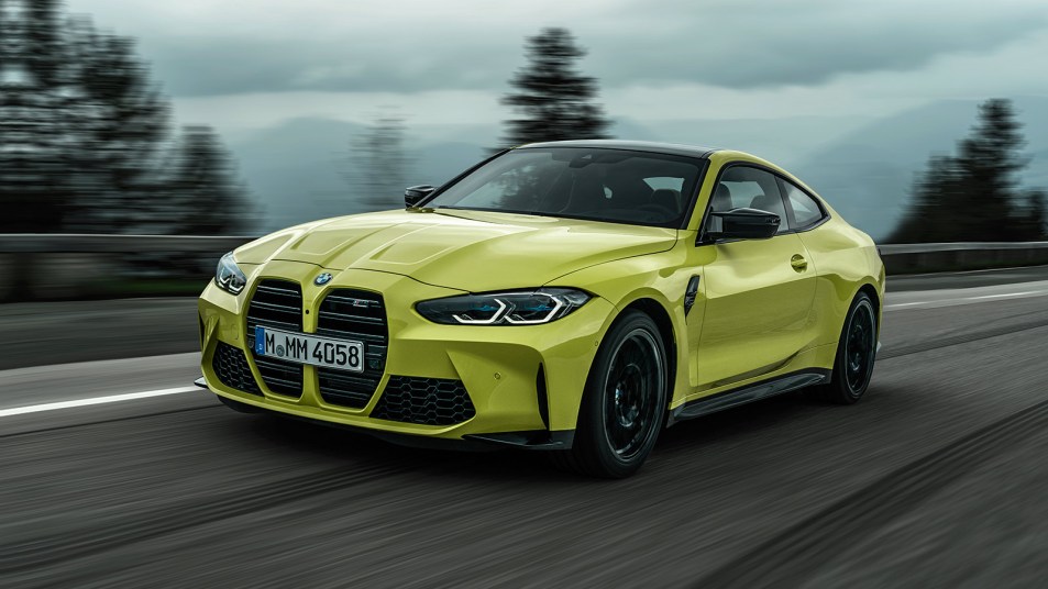 2022 BMW M4 driving in neon green