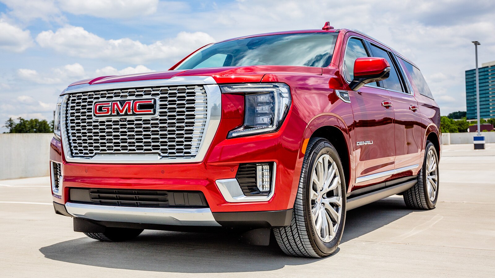 2021 GMC Yukon Denali front left side in metallic red