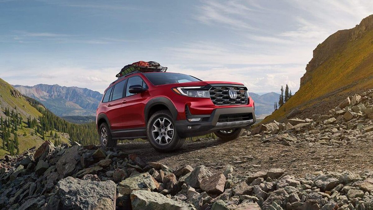 2022 Honda Passport Elite front right in red