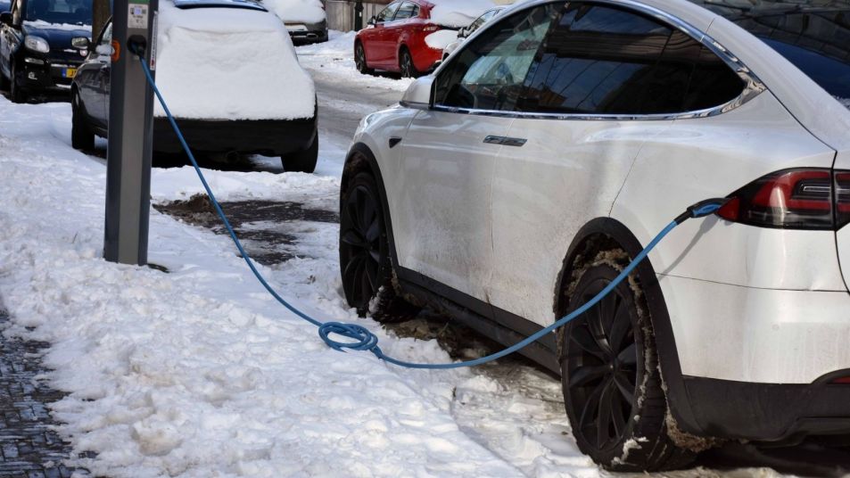Electric car charging in the snow