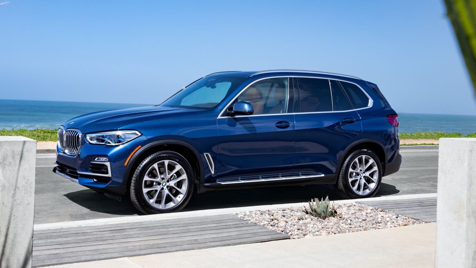 2019 BMW X5 near ocean in blue