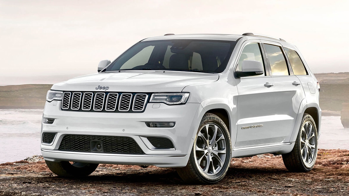 2019 Jeep Grand Cherokee Summit front left in white