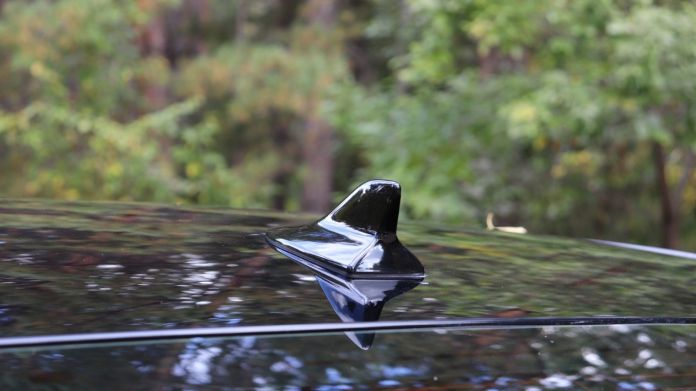 Shark type of antenna on black car
