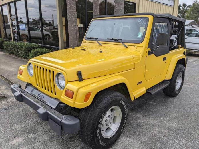 1999 Jeep Wrangler Sport in yellow.