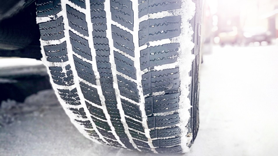 hybrid car tire on winter road