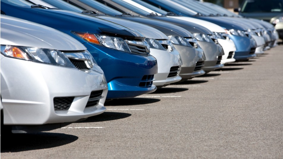New cars in a dealership lot.