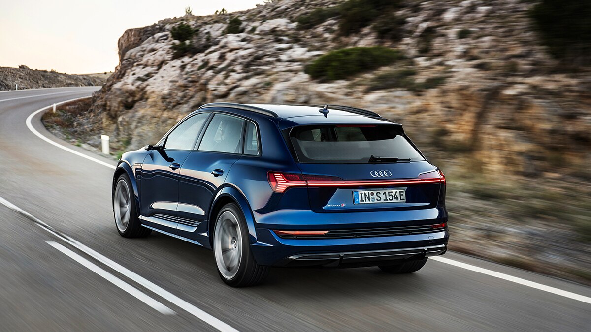 2023 Audi e-tron S rear left in blue