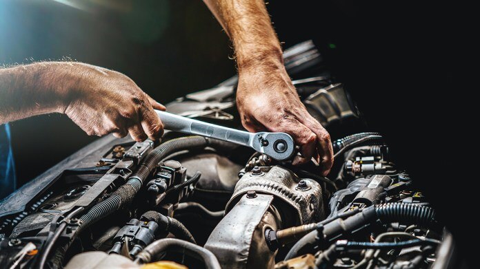 Mechanic Working on Engine