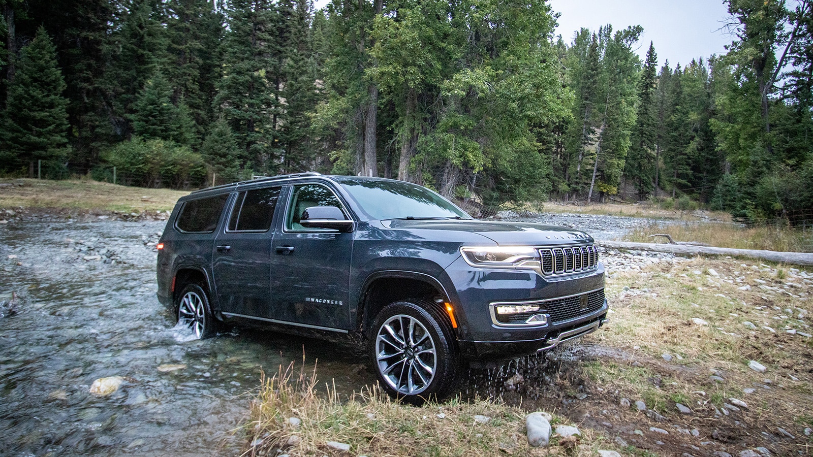 https://www.autotrader.com/wp-content/uploads/2022/10/2023-wagoneer-l-profile-off-road.jpg