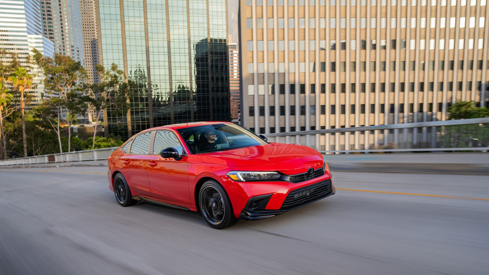 2023 Honda Civic Sedan Sport Driving in red