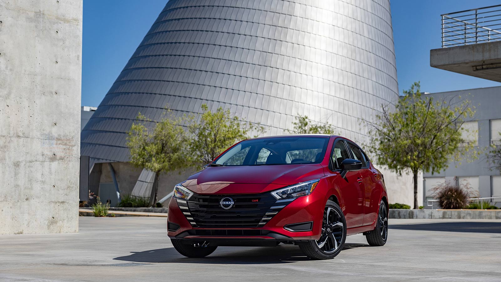 2023 Nissan Versa SR front left in red