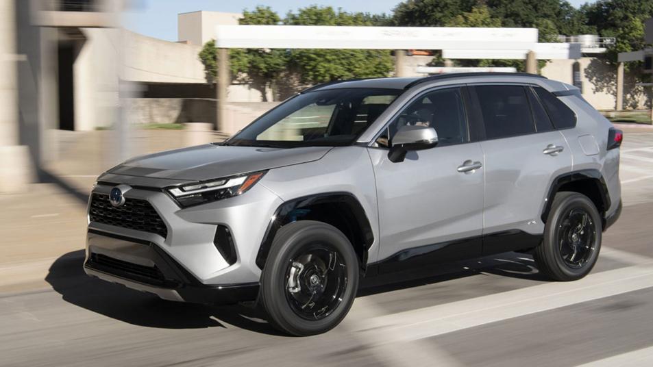 2023 Toyota RAV4 Hybrid driving in silver