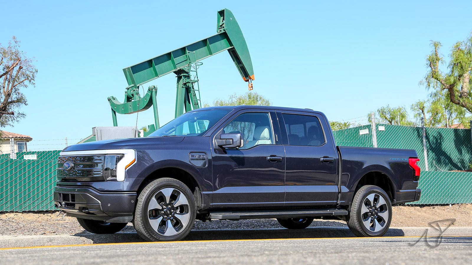 2022 Ford F-150 Lightning front of oil rig lifestyle