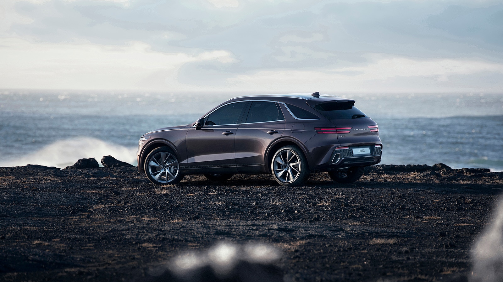 2022 Genesis GV70 rear profile in purple