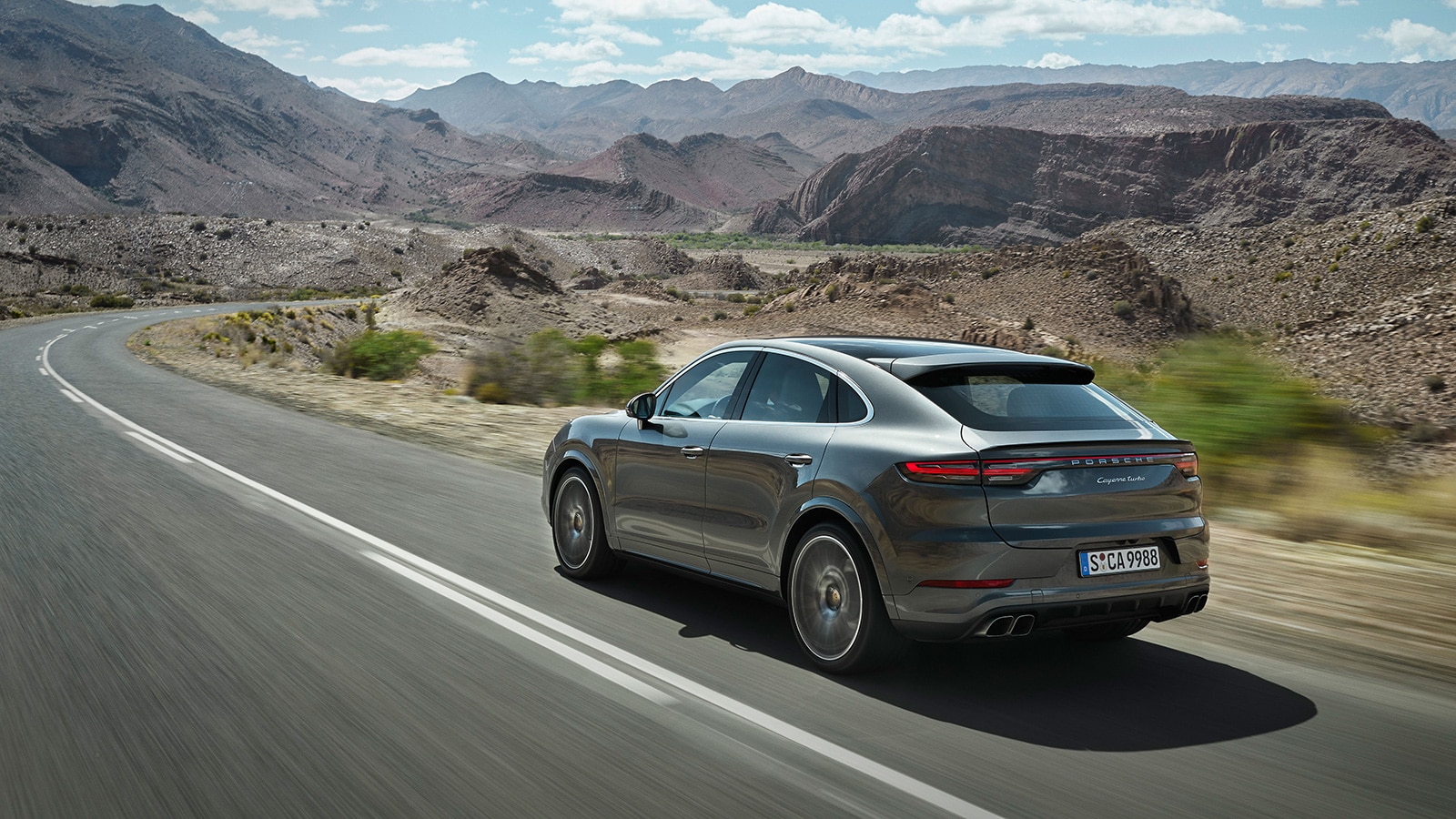 2023 Porsche Cayenne Coupe Turbo rear left in metallic grey
