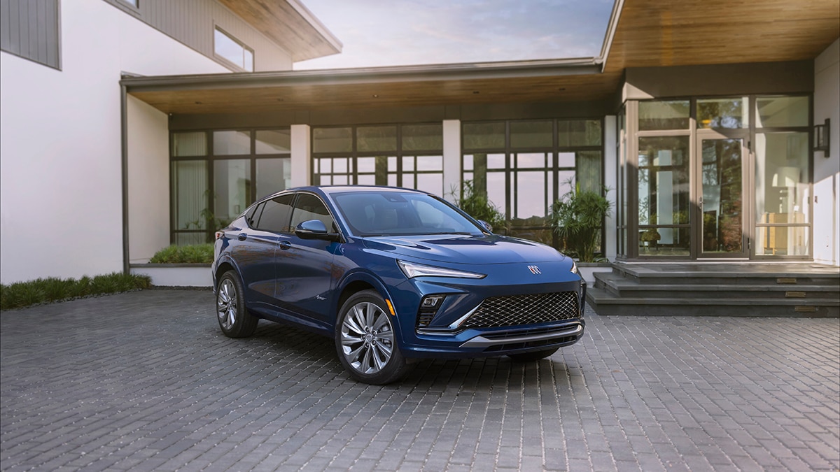 Front 3/4 view of the 2024 Buick Envista Avenir in Ocean Blue Metallic. Preproduction model shown. Actual production model may vary. Available in summer 2023.