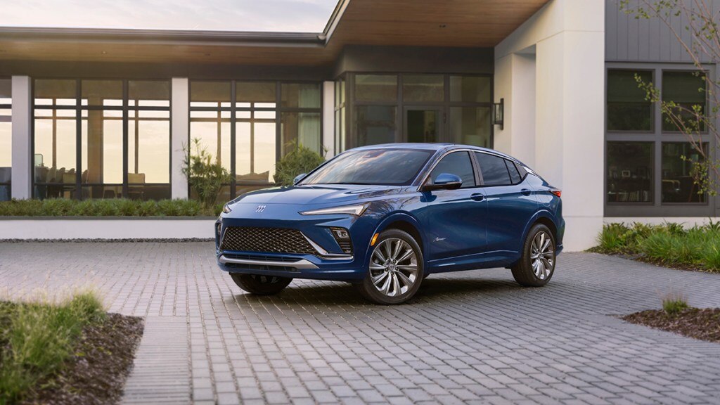 Front 3/4 view of the 2024 Buick Envista Avenir in Ocean Blue Metallic. Preproduction model shown. Actual production model may vary. Available in summer 2023.