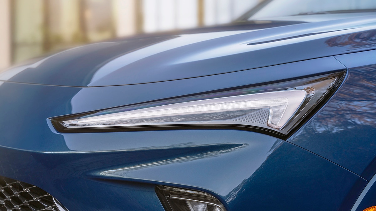 Close-up view of the driver side headlight on the 2024 Buick Envista Avenir in Ocean Blue Metallic. Preproduction model shown. Actual production model may vary. Available in summer 2023.