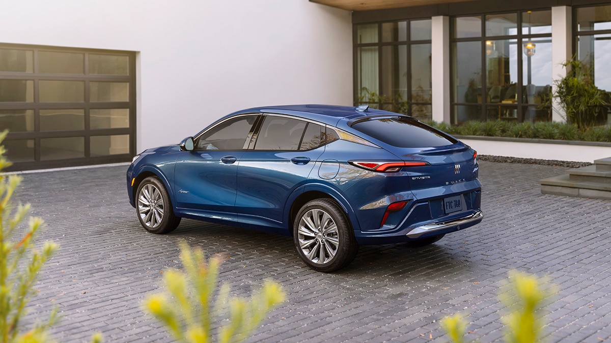 Rear 7/8 view of the 2024 Buick Envista Avenir in Ocean Blue Metallic. Preproduction model shown. Actual production model may vary. Available in summer 2023.