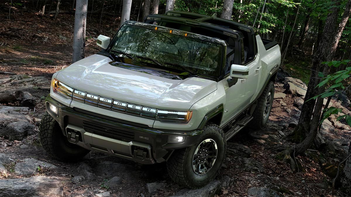 2024 GMC Hummer EV2 Pickup in white in a forest.