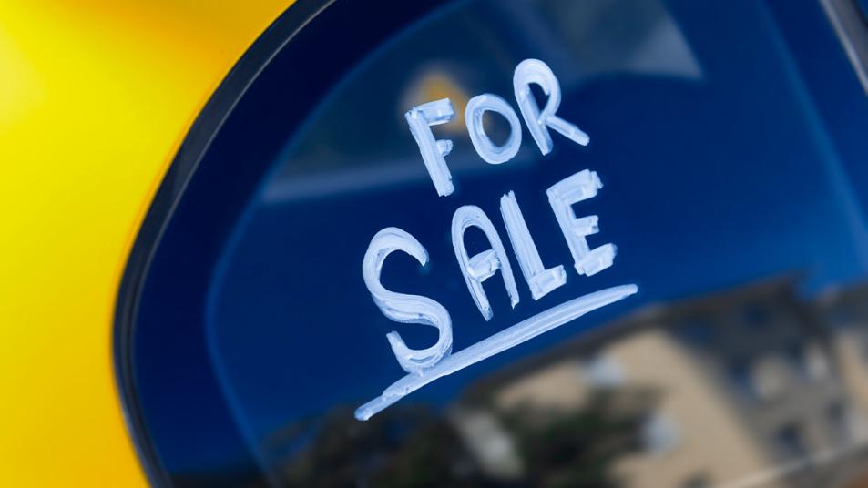 a car with the words for sale on the window