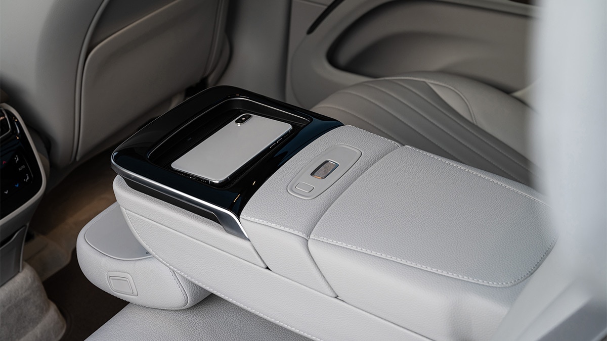 The Executive Rear Seat Package includes an upgraded rear armrest with a wireless charging pad.