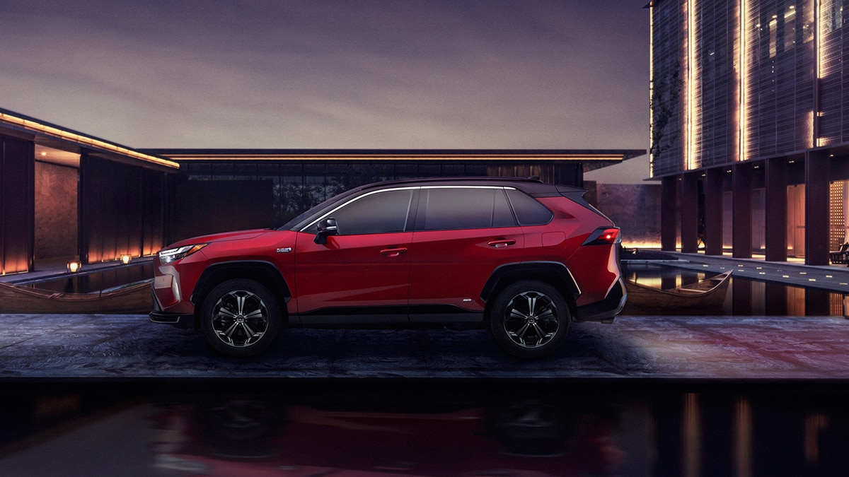 The 2024 Toyota RAV4 Prime XSE in Supersonic Red with a Black Metallic roof. 