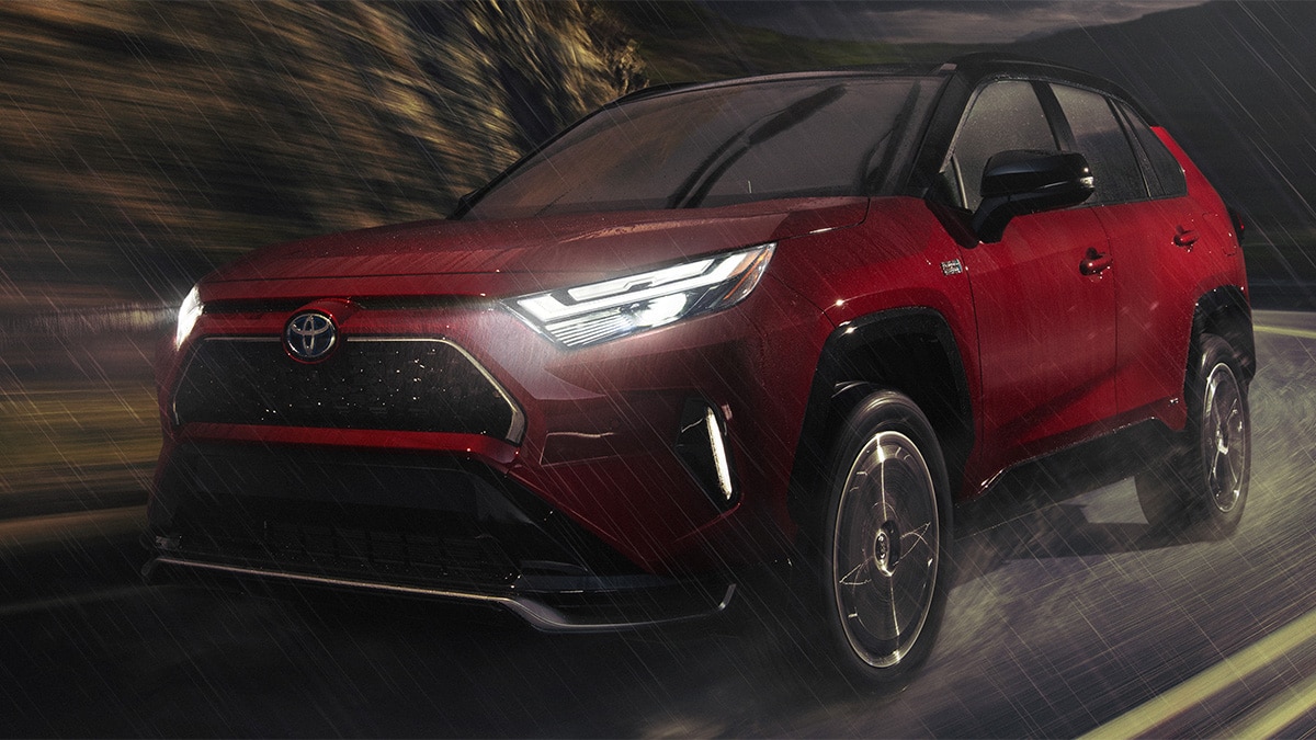 The 2024 Toyota RAV4 Prime XSE in Supersonic Red with a Black Metallic roof. 