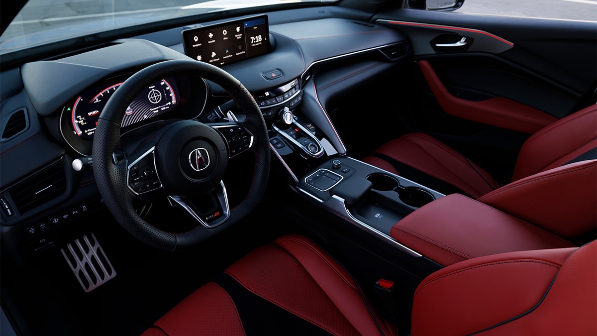 The 2024 TLX A-Spec also gets a flat-bottom steering wheel, sport seats, and red instrument panel lighting. 