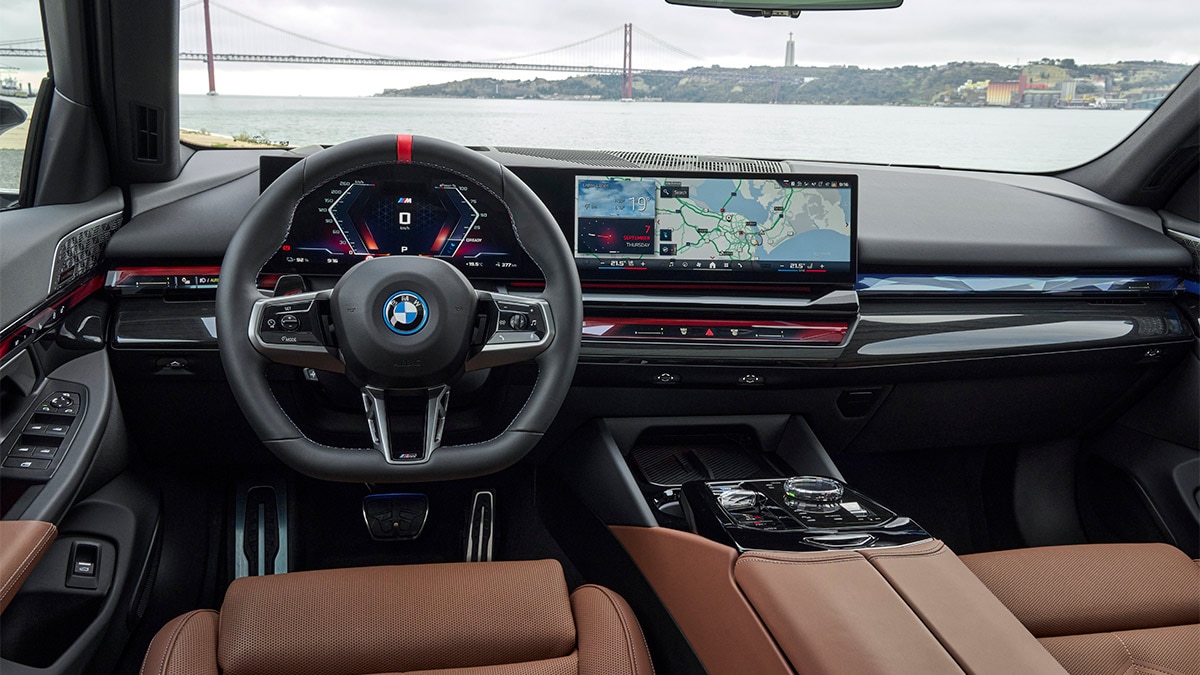 Looking serious: the interior of the 2024 BMW i5 M60 xDrive. Note the 12.3-inch digital gauge cluster and a 14.9-inch infotainment screen.