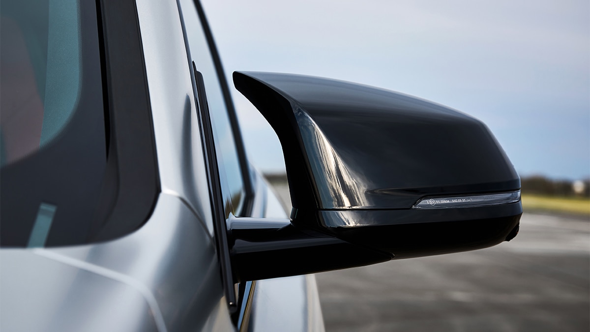 Turn signals are integrated into the side mirror housings of the 2024 BMW X1 M35i. 
