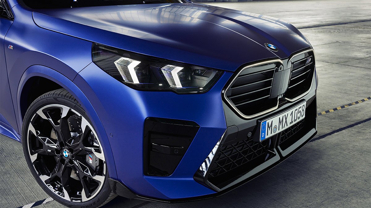 The powerful M Sport brakes are clearly visible behind the 20-inch alloy wheels of the 2024 BMW X2 M35i. 