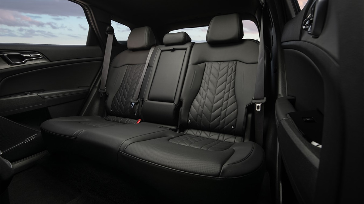 The rear bench seat of the 2024 Kia Sportage Plug-In Hybrid is most comfortable for two, but can accommodate three when needed. 