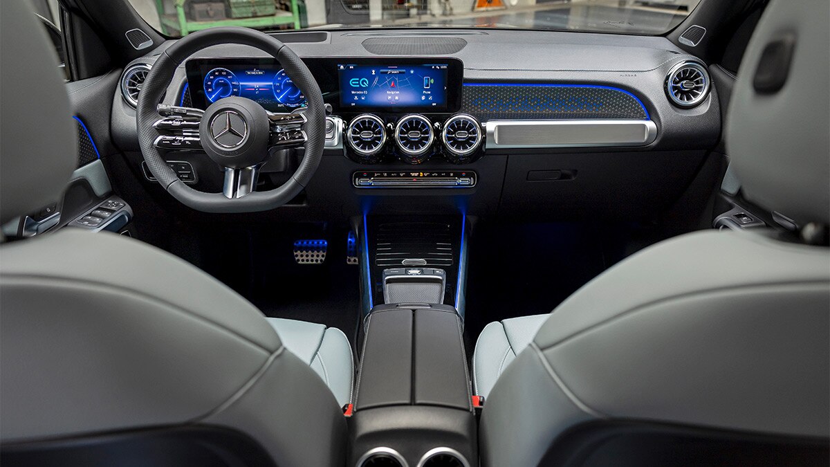 The EQB interior is characterized by large digital screens and circular air vents. 